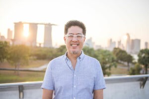 simon cheong in singapore with marina bay sands in the background