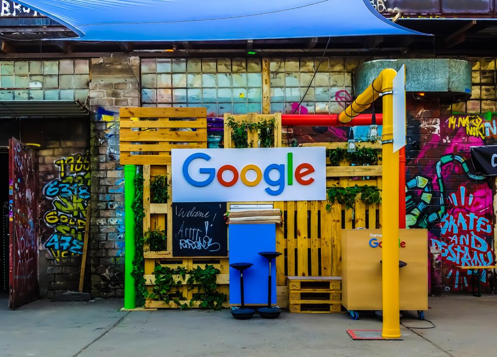 Google Logo in Street Pop Up With Graffiti and Pipes in the Background