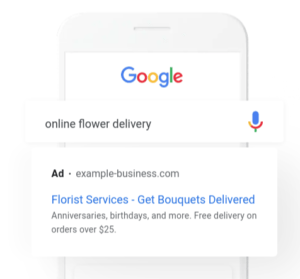 Sample Google Search Ad Displayed Over White Phone with Google Logo